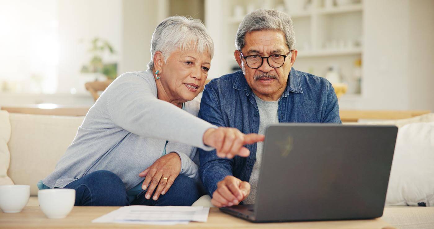 A couple comparing plans at home