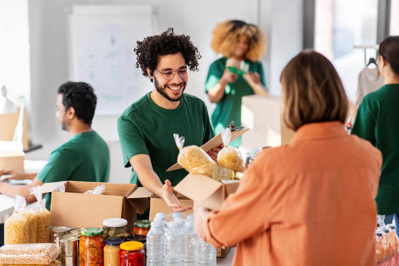 Volunteers packing meals at a community food program